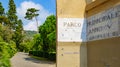 Genova, Italy. Marble sign at the entrance to the Nervi Municipal Park. View of a park avenue with lawns and trees. 2023-10-06 Royalty Free Stock Photo