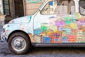 Genova, Italy - vintage Fiat 500 car painted with traditional cityscape of Liguria Region - Italy travel destination
