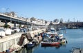 Genova port sea view with yachts, boats, and elevated road. Italy