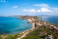 View of the hills by the sea with the old tower in the background San Giovanni di Sinis, Sardidia Royalty Free Stock Photo