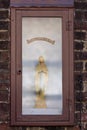 Gent, Belgium - March 22, 2020: Small Holy Mary statue in the Saint Elisabeth beguinage or Groot Begijnhof. Unesco. Royalty Free Stock Photo