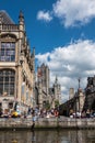 Students sitting on quay of Leie River in Gent, Flanders, Belgium Royalty Free Stock Photo