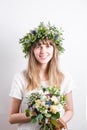 Gentle beauty portrait of a beautiful girl in wreath roses