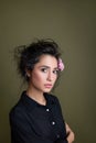 Gentle beauty portrait of beautiful young female. Girl dressed in black shirt. Gentle makeup. Woman look at camera.