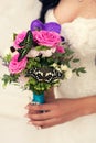 Gentle bridal bouquet in hands with butterfly Royalty Free Stock Photo