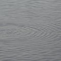 Gentle concentric ripples form on the surface of a body of water, creating a pattern of Royalty Free Stock Photo