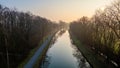 Tranquil Dawn Over Canal Flanked by Trees in Aerial Perspective Royalty Free Stock Photo
