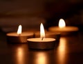 The gentle flicker of candle flames in a dimly lit room, providing a soft and soothing light source Royalty Free Stock Photo