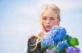 Gentle flower for delicate woman. Pure beauty. Tenderness of young skin. Springtime bloom. Girl tender blonde hold Royalty Free Stock Photo