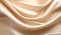 Gentle flowing curves of soft beige satin fabric with subtle light reflections creating a and smooth abstract background Royalty Free Stock Photo