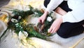 Gentle hands of woman decorate New Year`s decorations for celebr Royalty Free Stock Photo