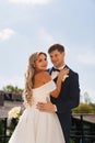 gentle and loving bride and groom in traditional wedding clothes on the terrace. Royalty Free Stock Photo