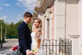 gentle and loving bride and groom in traditional wedding clothes on the terrace. Royalty Free Stock Photo