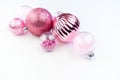 Gentle pink baubles on a white background. Christmas mood Royalty Free Stock Photo