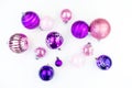 Gentle pink and purple baubles on a white background. Christmas mood Royalty Free Stock Photo