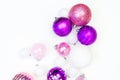 Gentle pink and purple baubles on a white background. Christmas mood Royalty Free Stock Photo