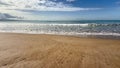Gentle sea waves on a sandy beach Royalty Free Stock Photo