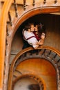 Gentle, sensual, sweet, passionate couple softly kissing on the background of vintage marble stairs in Lviv. View from Royalty Free Stock Photo