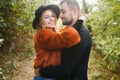 gentle and stylish couple are having a walk in the autumn park. Royalty Free Stock Photo