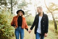 gentle and stylish couple are having a walk in the autumn park. Royalty Free Stock Photo