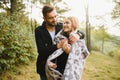 gentle and stylish couple are having a walk in the autumn park. Royalty Free Stock Photo