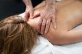 Professional masseur doing relaxing massage on lady back Royalty Free Stock Photo