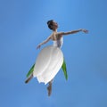 Portrait of beautiful graceful girl, ballerina dancing in dress made from flower, white lily. Contemporary art collage