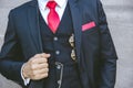 Gentle uniform stylish tuxedo luxury suit with red necktie for modern groom or fashionable business person Royalty Free Stock Photo