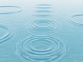 Gentle water ripples create mesmerizing circular patterns on calm surface Royalty Free Stock Photo