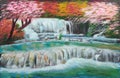 Gentle waterfalls surrounded by beautiful flowering trees of autumn