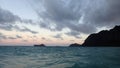 Gentle wave in Waimanalo Bay looking towards Rabbit island and Rock island at dusk Royalty Free Stock Photo