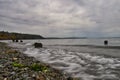 Gentle waves on the beach on a cloudy day