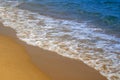 Gentle waves on sandy beach Royalty Free Stock Photo