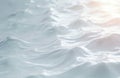 Gentle waves on water surface create abstract background with soft light. Ripples reflect sun rays forming elegant fluid pattern Royalty Free Stock Photo