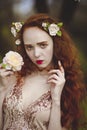 Portrait of Gentle woman with long red hair sroz. Red-haired sensual girl with pale skin and blue eyes with bright Royalty Free Stock Photo