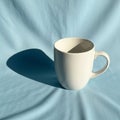 Gentle wrinkles and the mug casts a distinct elongated shadow Royalty Free Stock Photo