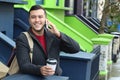 Gentleman calling by phone outdoors Royalty Free Stock Photo