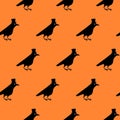 Gentleman crow seamless pattern, blackbird with top hat. Cute raven illustration on orange blackground