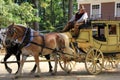 Gentleman dressed in period clothing taking visitors for wagon ride,Old Sturbridge Village,September 2014 Royalty Free Stock Photo