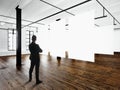 Gentleman Modern art museum expo loft interior.Open space studio.Empty white canvas hanging.Wood floor,bricks wall Royalty Free Stock Photo