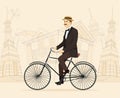 Gentleman on retro vintage old bicycle on old city background