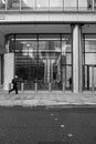 A gentleman running across the street central London UK