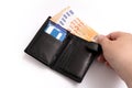 Gentleman's wallet with credit cards with one hand taking out banknotes on white background Royalty Free Stock Photo