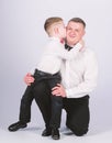 Gentleman upbringing. Father and son formal clothes outfit. Grow up gentleman. Dad and boy white shirts with bow ties Royalty Free Stock Photo