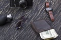 Gentlemanly set: sunglasses, perfume, wallet,camera, watch on wooden background Royalty Free Stock Photo