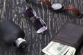 Gentlemanly set: sunglasses, perfume, wallet, watch on wooden background Royalty Free Stock Photo