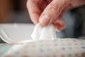 Gently Hand picked a wet wipes in package box, Wet wipes in a hand Royalty Free Stock Photo