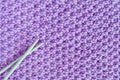Purple woolen yarn with knitting needles Royalty Free Stock Photo