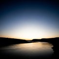 Gently reflects the fading light enhancing the tranquil essence of Royalty Free Stock Photo