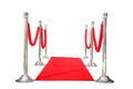 Genuine Hollywood Red Carpet with Red Velvet Ropes and Silver Stanchions, isolated on white with room for your text Royalty Free Stock Photo